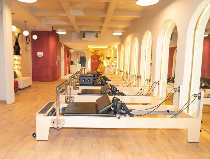 The Sanpada Pilates studio floor with reformers and arched lighting